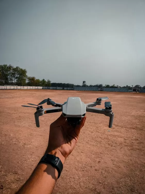 free photo of hand holding drone jpeg